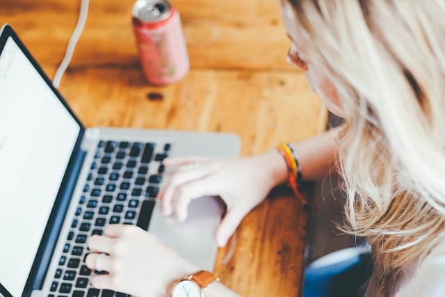 a woman sitting at a computer