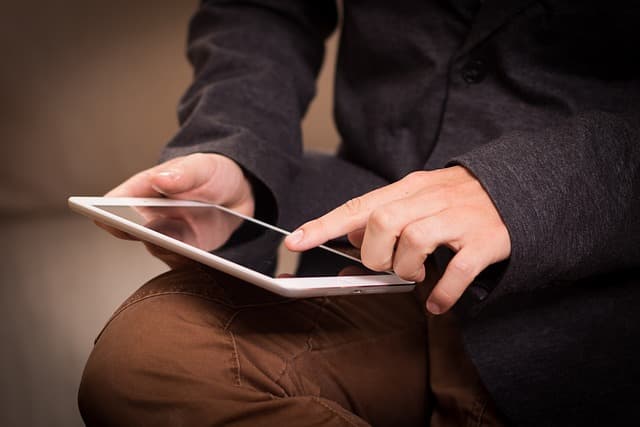 man works on a tablet
